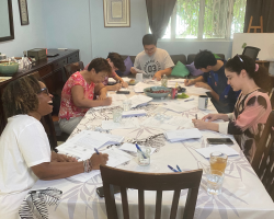 Writing hand-written get out the vote letters to be mailed to US voters who are less likely to vote